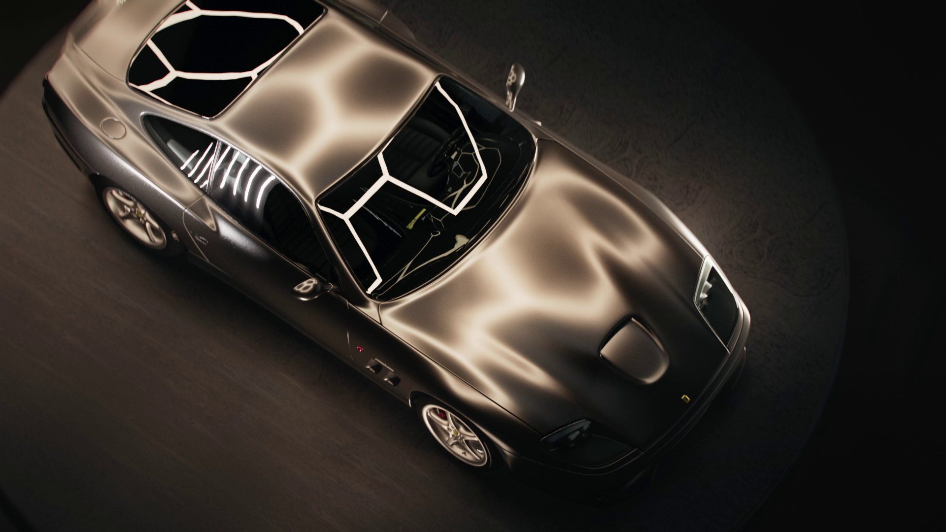 A frame from the teaser: a Ferrari seen from above, light drawn across its bodywork.