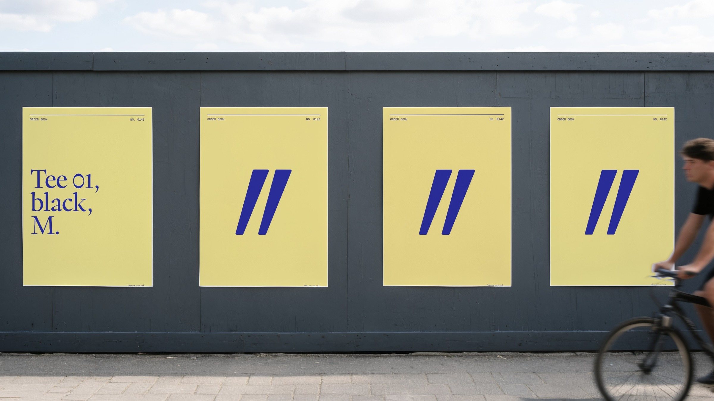 Four canary posters on a grey hoarding: the first reads Tee 01, black, M., the other three only the ditto