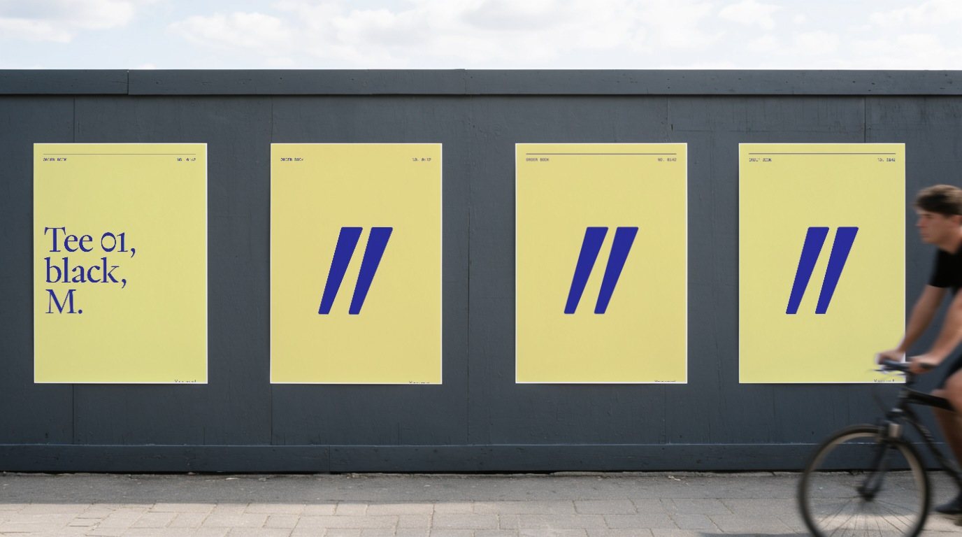 Four canary posters on a grey hoarding: the first reads Tee 01, black, M., the other three only the ditto