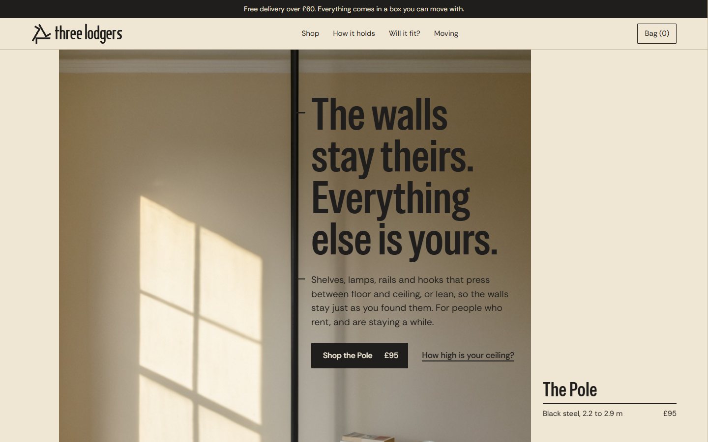 The Three Lodgers homepage: a sunlit wall with the Pole; the page's line continues the photograph's pole, and the headline clamps to it.