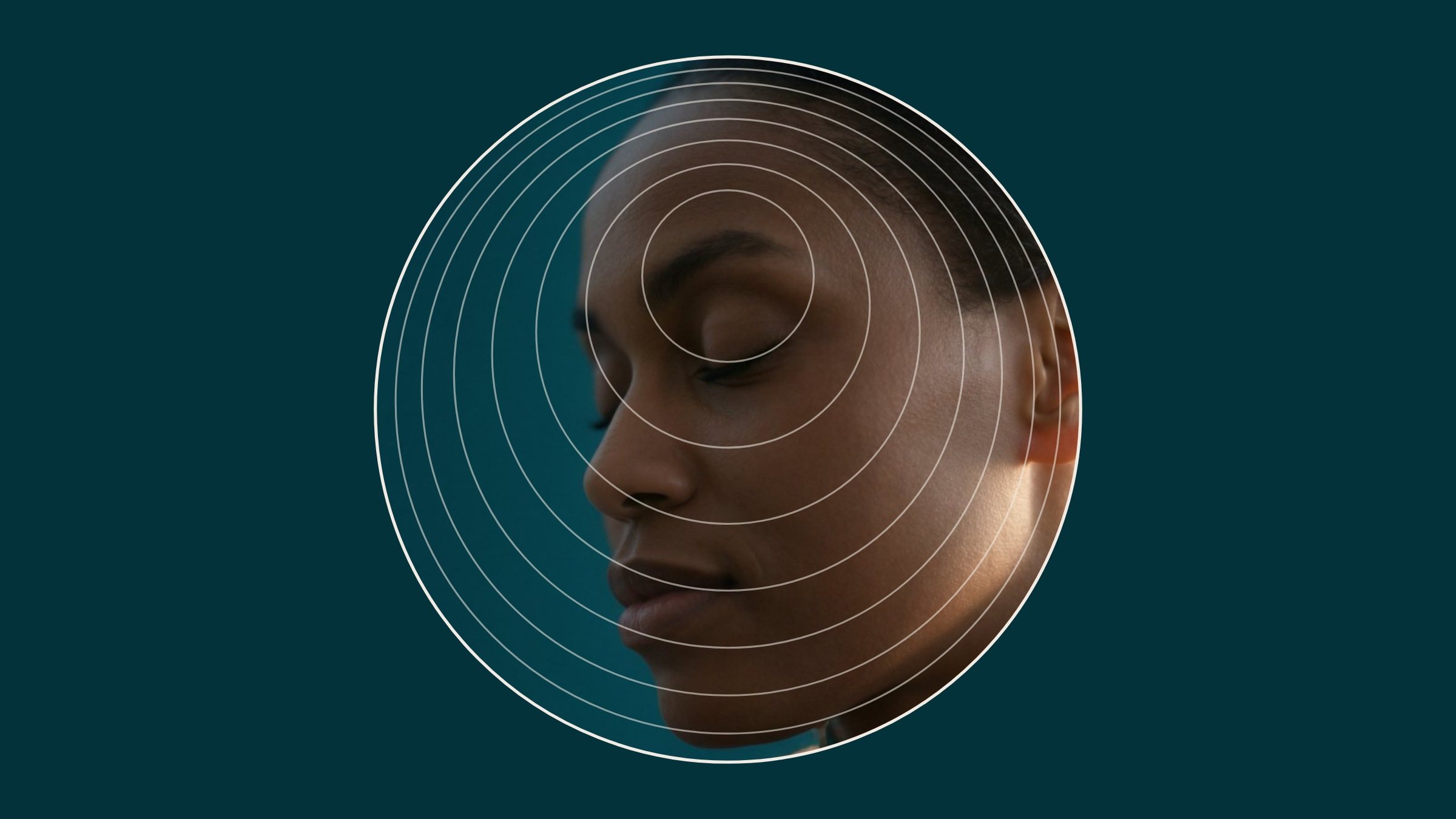 The True Glow rings holding a portrait in back-light: the edge of the ear glows warm inside the layers.