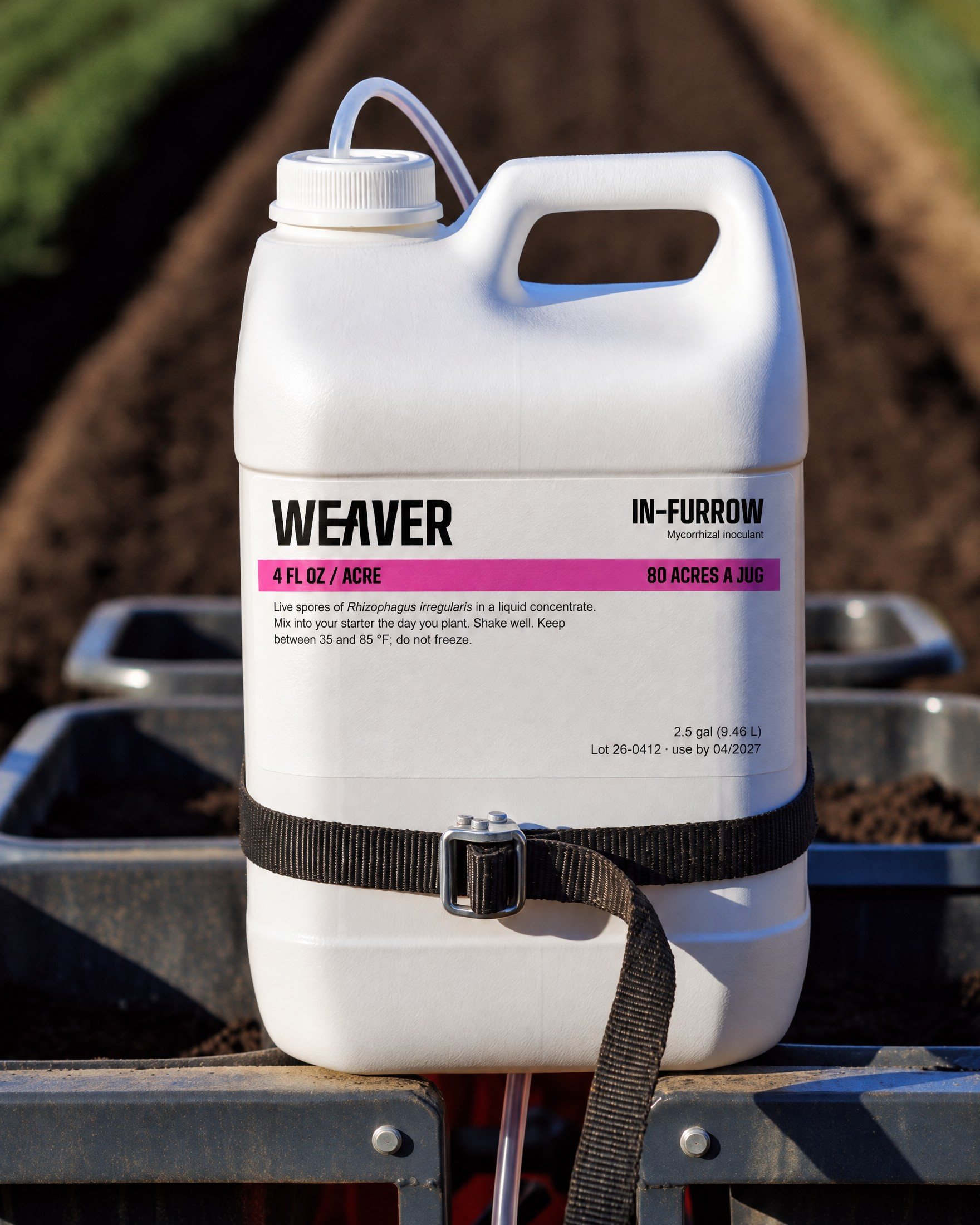 The Weaver jug strapped to a planter toolbar